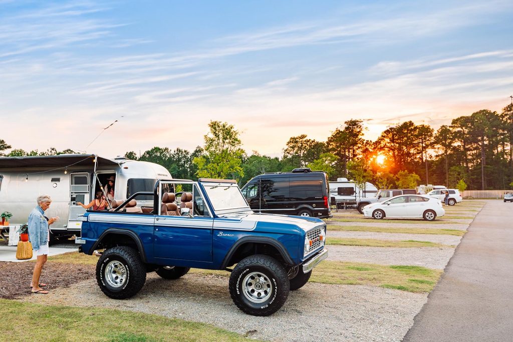 large truck and airstream camper parked at site